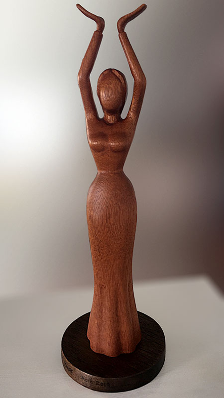 Woodcarving of a dancing lady