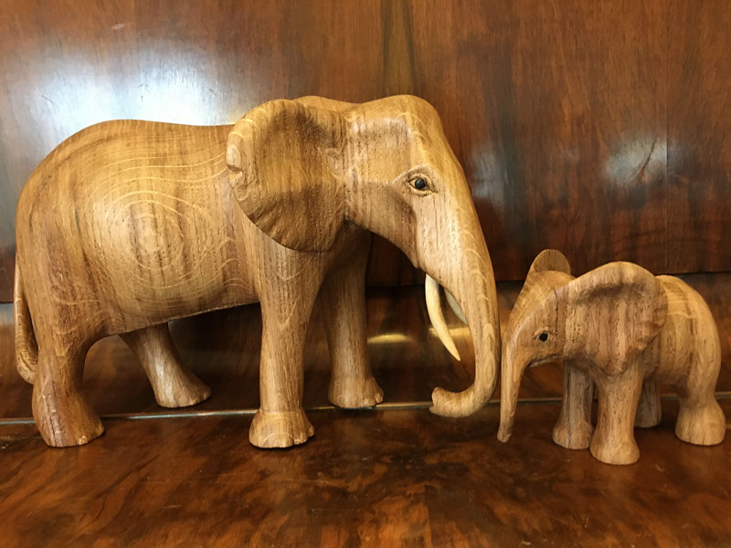 Woodcarvings of a mother and baby elephants