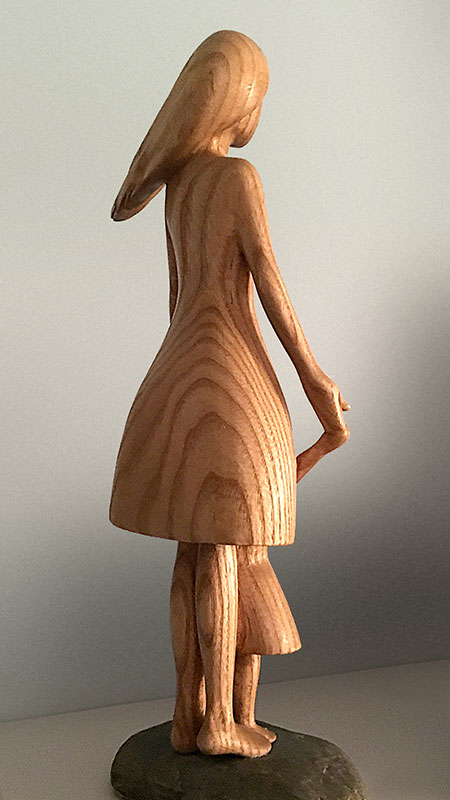 Woodcarving of a mother and girl