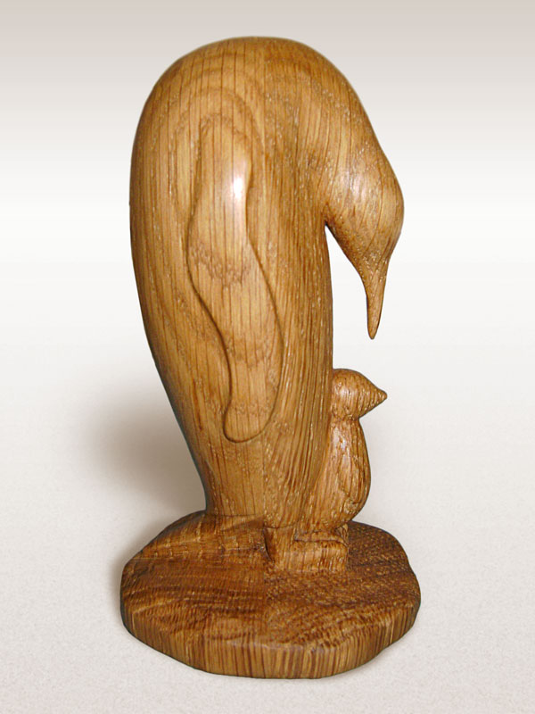 Woodcarving of a penguin and baby
